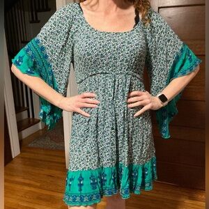 Flowy mini dress- size M with interesting back